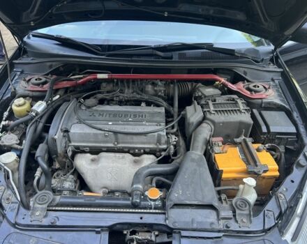 Черный Мицубиси Лансер, объемом двигателя 2 л и пробегом 240 тыс. км за 5600 $, фото 7 на Automoto.ua