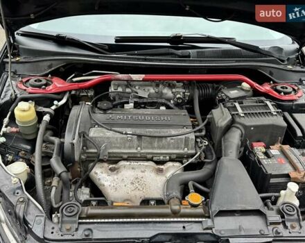 Черный Мицубиси Лансер, объемом двигателя 2 л и пробегом 219 тыс. км за 4400 $, фото 7 на Automoto.ua
