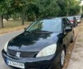 Черный Мицубиси Лансер, объемом двигателя 1.6 л и пробегом 224 тыс. км за 2992 $, фото 1 на Automoto.ua