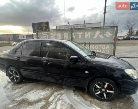 Черный Мицубиси Лансер, объемом двигателя 1.6 л и пробегом 180 тыс. км за 3499 $, фото 7 на Automoto.ua