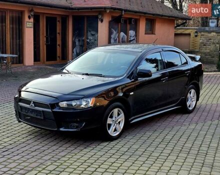 Черный Мицубиси Лансер, объемом двигателя 2 л и пробегом 260 тыс. км за 6555 $, фото 7 на Automoto.ua