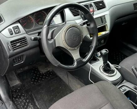 Черный Мицубиси Лансер, объемом двигателя 2 л и пробегом 219 тыс. км за 4400 $, фото 5 на Automoto.ua