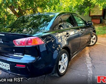 Черный Мицубиси Лансер, объемом двигателя 2 л и пробегом 290 тыс. км за 5800 $, фото 1 на Automoto.ua