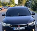 Черный Мицубиси Лансер, объемом двигателя 2 л и пробегом 220 тыс. км за 6800 $, фото 1 на Automoto.ua