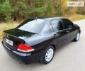 Чорний Міцубісі Lancer, об'ємом двигуна 1.6 л та пробігом 240 тис. км за 4950 $, фото 2 на Automoto.ua