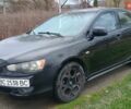 Чорний Міцубісі Lancer, об'ємом двигуна 2 л та пробігом 246 тис. км за 4599 $, фото 1 на Automoto.ua