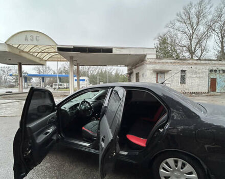 Черный Мицубиси Лансер, объемом двигателя 1.58 л и пробегом 254 тыс. км за 5000 $, фото 13 на Automoto.ua