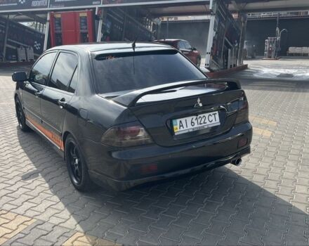 Черный Мицубиси Лансер, объемом двигателя 2 л и пробегом 224 тыс. км за 5800 $, фото 3 на Automoto.ua