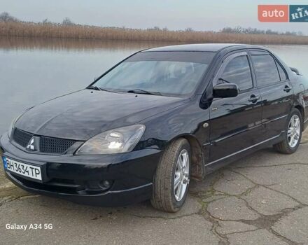 Черный Мицубиси Лансер, объемом двигателя 2 л и пробегом 286 тыс. км за 4000 $, фото 2 на Automoto.ua