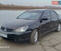 Черный Мицубиси Лансер, объемом двигателя 2 л и пробегом 286 тыс. км за 4000 $, фото 2 на Automoto.ua