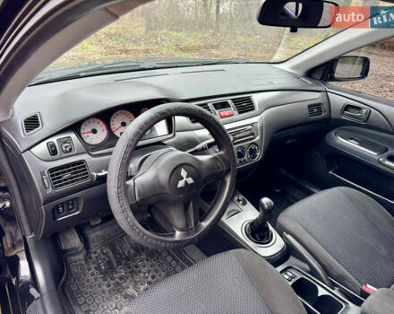 Черный Мицубиси Лансер, объемом двигателя 1.6 л и пробегом 216 тыс. км за 4990 $, фото 11 на Automoto.ua