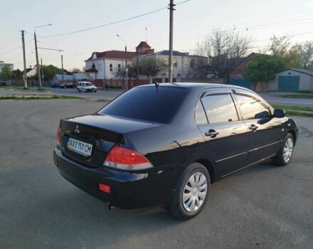 Черный Мицубиси Лансер, объемом двигателя 1.6 л и пробегом 32 тыс. км за 9000 $, фото 16 на Automoto.ua