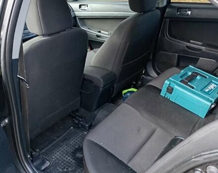 Черный Мицубиси Лансер, объемом двигателя 2 л и пробегом 200 тыс. км за 5900 $, фото 3 на Automoto.ua