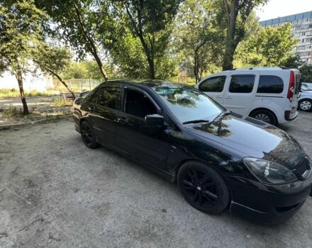 Черный Мицубиси Лансер, объемом двигателя 2 л и пробегом 240 тыс. км за 5600 $, фото 2 на Automoto.ua