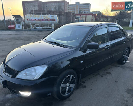 Черный Мицубиси Лансер, объемом двигателя 1.6 л и пробегом 315 тыс. км за 4000 $, фото 3 на Automoto.ua