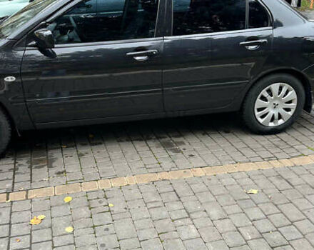 Чорний Міцубісі Lancer, об'ємом двигуна 1.59 л та пробігом 300 тис. км за 3400 $, фото 2 на Automoto.ua