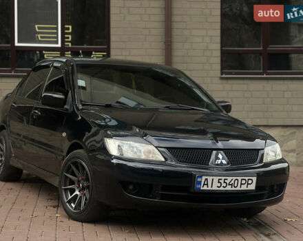 Черный Мицубиси Лансер, объемом двигателя 1.6 л и пробегом 211 тыс. км за 5700 $, фото 3 на Automoto.ua