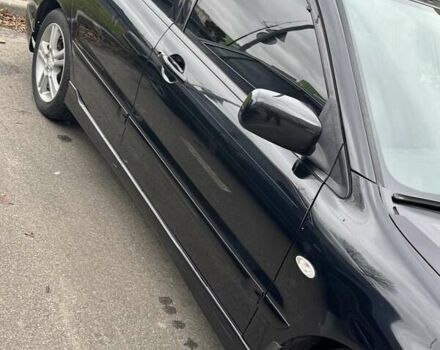 Черный Мицубиси Лансер, объемом двигателя 2 л и пробегом 219 тыс. км за 4400 $, фото 2 на Automoto.ua