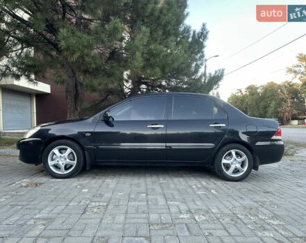 Черный Мицубиси Лансер, объемом двигателя 1.59 л и пробегом 269 тыс. км за 4999 $, фото 6 на Automoto.ua