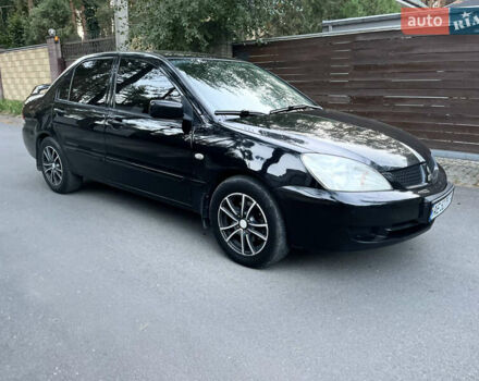 Черный Мицубиси Лансер, объемом двигателя 1.58 л и пробегом 278 тыс. км за 4800 $, фото 5 на Automoto.ua