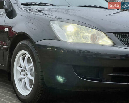 Чорний Міцубісі Lancer, об'ємом двигуна 1.6 л та пробігом 303 тис. км за 4350 $, фото 13 на Automoto.ua