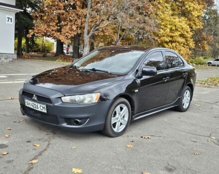 Черный Мицубиси Лансер, объемом двигателя 2 л и пробегом 115 тыс. км за 5000 $, фото 1 на Automoto.ua