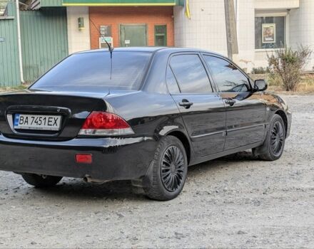 Черный Мицубиси Лансер, объемом двигателя 1.6 л и пробегом 226 тыс. км за 4800 $, фото 3 на Automoto.ua