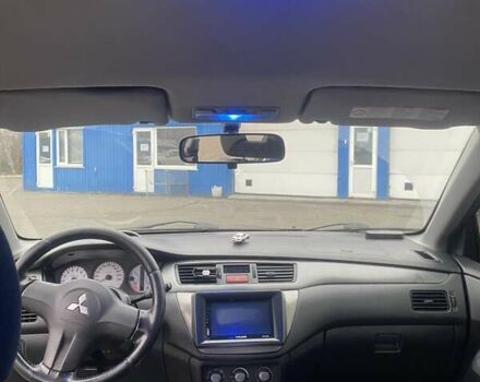 Черный Мицубиси Лансер, объемом двигателя 1.58 л и пробегом 263 тыс. км за 4000 $, фото 1 на Automoto.ua