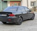 Черный Мицубиси Лансер, объемом двигателя 1.6 л и пробегом 226 тыс. км за 4800 $, фото 3 на Automoto.ua
