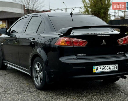 Черный Мицубиси Лансер, объемом двигателя 2 л и пробегом 215 тыс. км за 5500 $, фото 9 на Automoto.ua