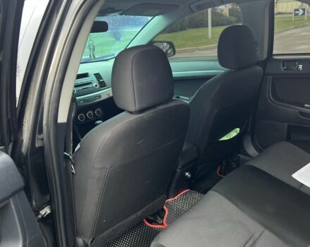 Черный Мицубиси Лансер, объемом двигателя 2 л и пробегом 350 тыс. км за 6700 $, фото 14 на Automoto.ua