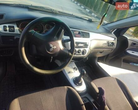 Чорний Міцубісі Lancer, об'ємом двигуна 1.59 л та пробігом 180 тис. км за 4999 $, фото 16 на Automoto.ua