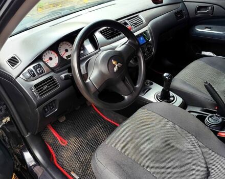 Черный Мицубиси Лансер, объемом двигателя 1.6 л и пробегом 171 тыс. км за 4350 $, фото 7 на Automoto.ua