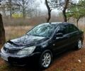 Чорний Міцубісі Lancer, об'ємом двигуна 1.6 л та пробігом 240 тис. км за 4700 $, фото 1 на Automoto.ua