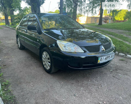 Чорний Міцубісі Lancer, об'ємом двигуна 1.58 л та пробігом 285 тис. км за 4500 $, фото 2 на Automoto.ua