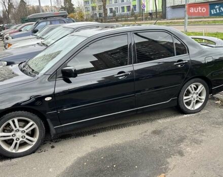 Черный Мицубиси Лансер, объемом двигателя 2 л и пробегом 219 тыс. км за 4400 $, фото 13 на Automoto.ua