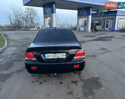 Черный Мицубиси Лансер, объемом двигателя 1.6 л и пробегом 315 тыс. км за 4000 $, фото 5 на Automoto.ua