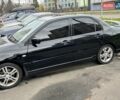 Черный Мицубиси Лансер, объемом двигателя 2 л и пробегом 219 тыс. км за 4400 $, фото 13 на Automoto.ua