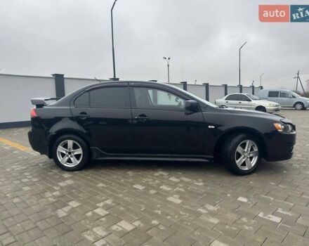 Черный Мицубиси Лансер, объемом двигателя 2 л и пробегом 259 тыс. км за 6500 $, фото 6 на Automoto.ua