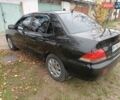 Чорний Міцубісі Lancer, об'ємом двигуна 1.58 л та пробігом 227 тис. км за 4100 $, фото 7 на Automoto.ua