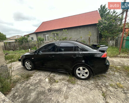 Чорний Міцубісі Lancer, об'ємом двигуна 2 л та пробігом 200 тис. км за 6900 $, фото 6 на Automoto.ua