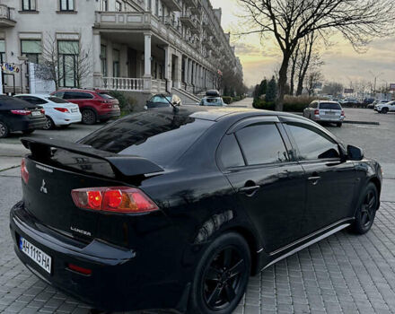 Черный Мицубиси Лансер, объемом двигателя 2 л и пробегом 245 тыс. км за 6200 $, фото 10 на Automoto.ua