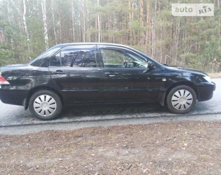 Чорний Міцубісі Lancer, об'ємом двигуна 1.58 л та пробігом 210 тис. км за 4200 $, фото 2 на Automoto.ua