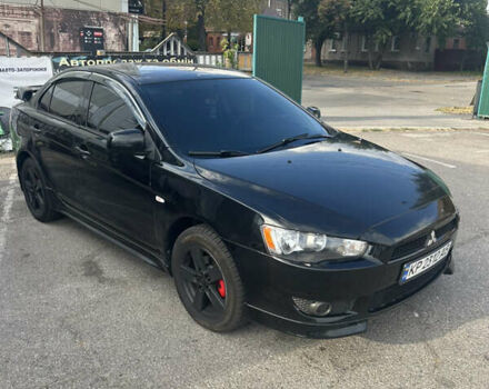 Черный Мицубиси Лансер, объемом двигателя 2 л и пробегом 208 тыс. км за 6500 $, фото 4 на Automoto.ua