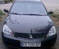 Чорний Міцубісі Lancer, об'ємом двигуна 1.6 л та пробігом 234 тис. км за 3900 $, фото 1 на Automoto.ua