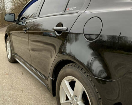 Черный Мицубиси Лансер, объемом двигателя 2 л и пробегом 164 тыс. км за 8300 $, фото 9 на Automoto.ua