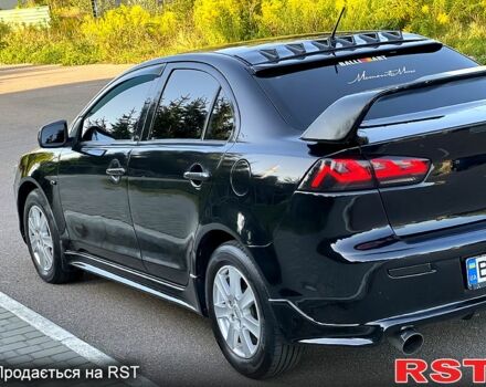 Черный Мицубиси Лансер, объемом двигателя 2 л и пробегом 216 тыс. км за 7500 $, фото 2 на Automoto.ua