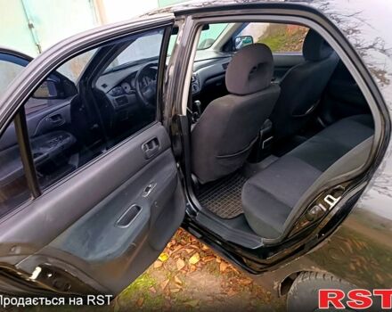 Чорний Міцубісі Lancer, об'ємом двигуна 1.6 л та пробігом 227 тис. км за 4100 $, фото 9 на Automoto.ua