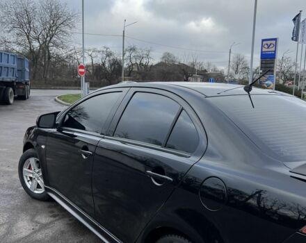 Черный Мицубиси Лансер, объемом двигателя 2 л и пробегом 350 тыс. км за 6700 $, фото 5 на Automoto.ua