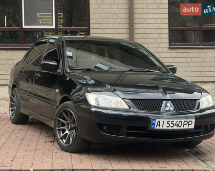Черный Мицубиси Лансер, объемом двигателя 1.6 л и пробегом 211 тыс. км за 5700 $, фото 2 на Automoto.ua
